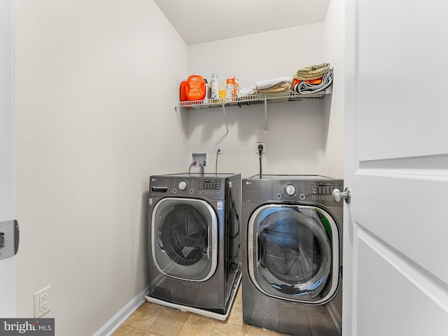 clothes washing area with independent washer and dryer