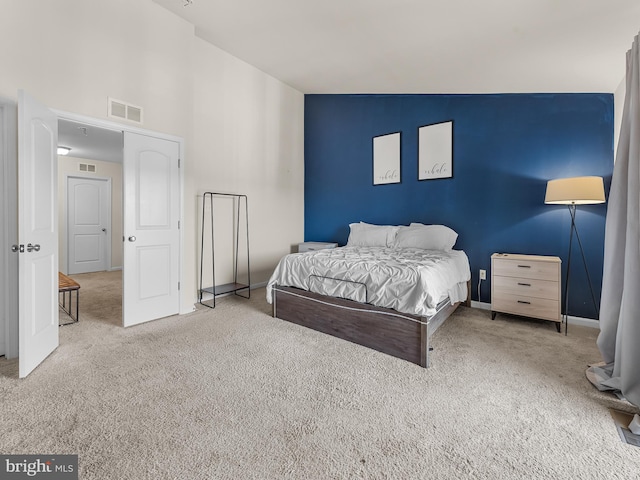 bedroom with lofted ceiling and carpet flooring