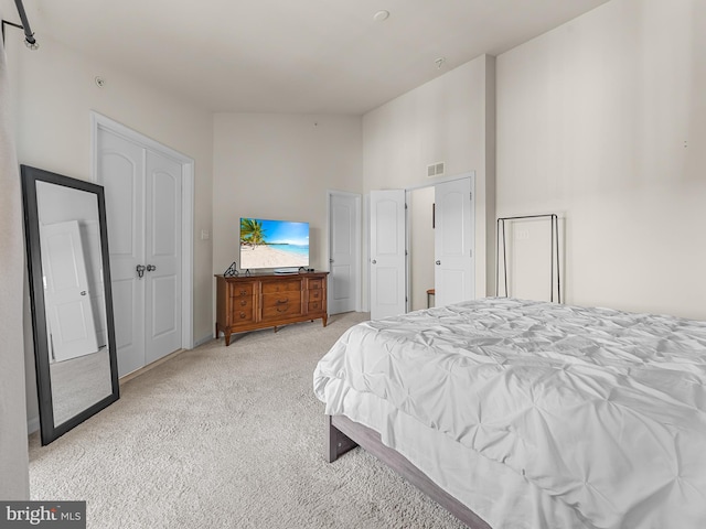 bedroom featuring light carpet