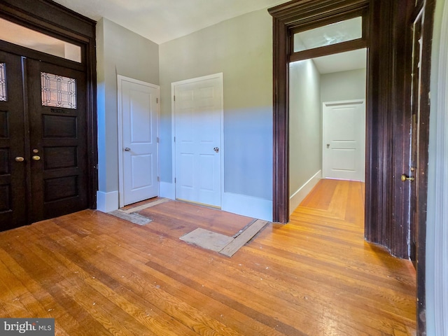 foyer with light hardwood / wood-style floors