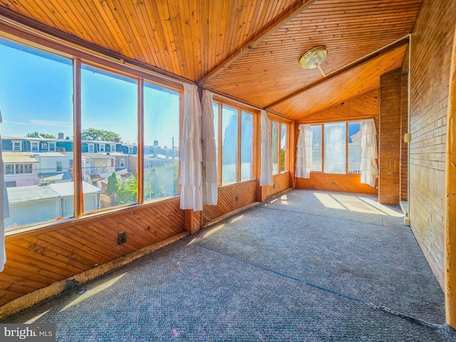 unfurnished sunroom featuring wooden ceiling and vaulted ceiling