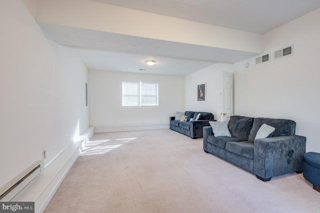 carpeted living room featuring baseboard heating