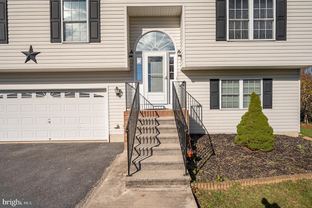 property entrance with a garage