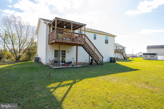 back of property with a lawn, a patio area, a deck, and central air condition unit