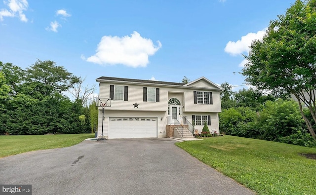 split foyer home with a front yard and a garage