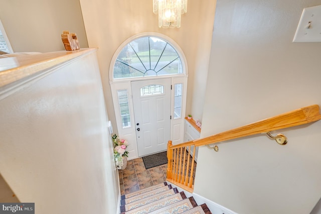 entryway with a notable chandelier