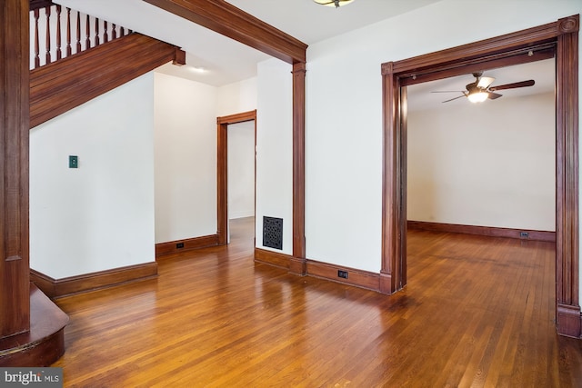 unfurnished room with hardwood / wood-style floors and ceiling fan