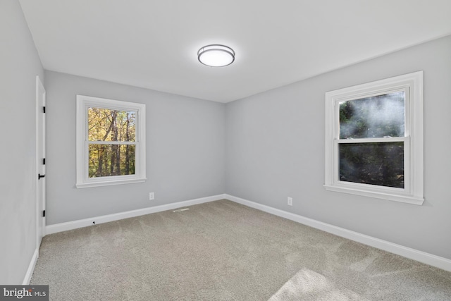 empty room featuring carpet flooring