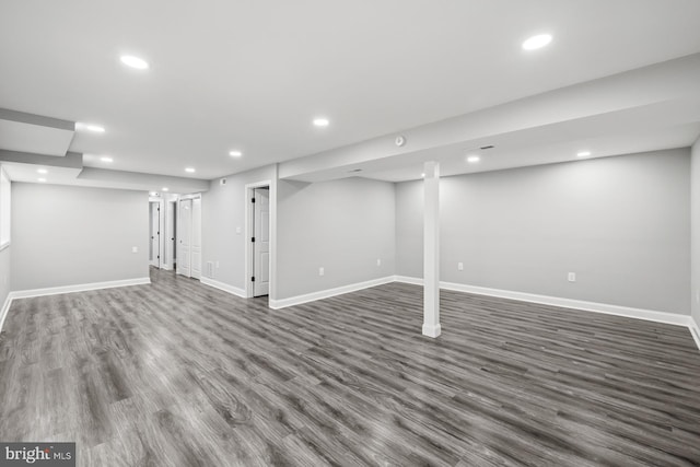 basement with dark wood-type flooring