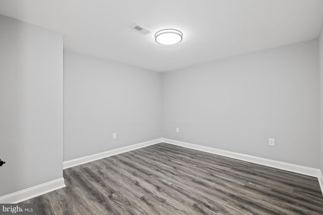 empty room featuring dark hardwood / wood-style floors