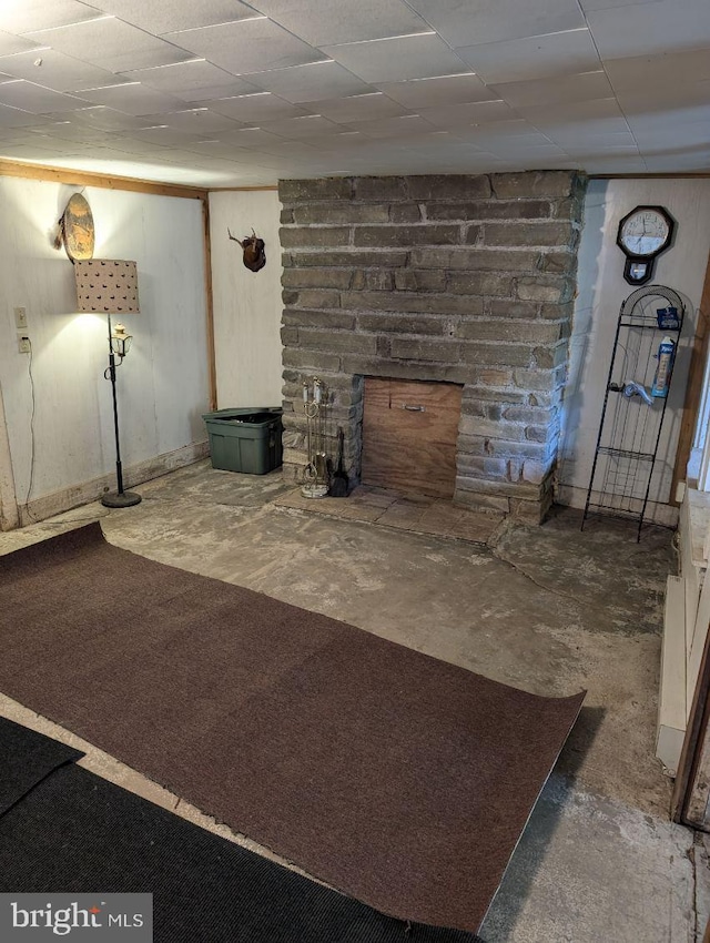 basement featuring a stone fireplace