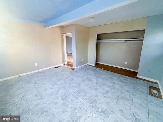 unfurnished bedroom featuring a closet