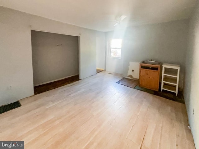 bonus room featuring light hardwood / wood-style floors and ceiling fan