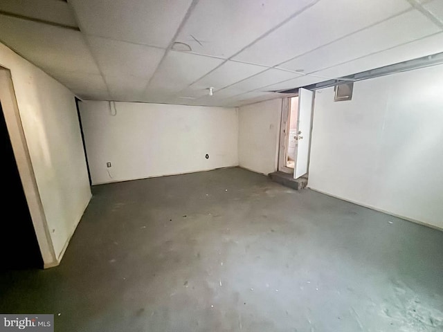 below grade area with a paneled ceiling