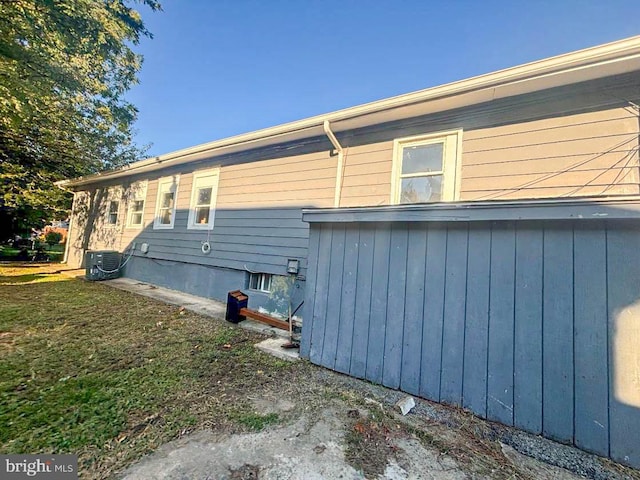 view of home's exterior with cooling unit