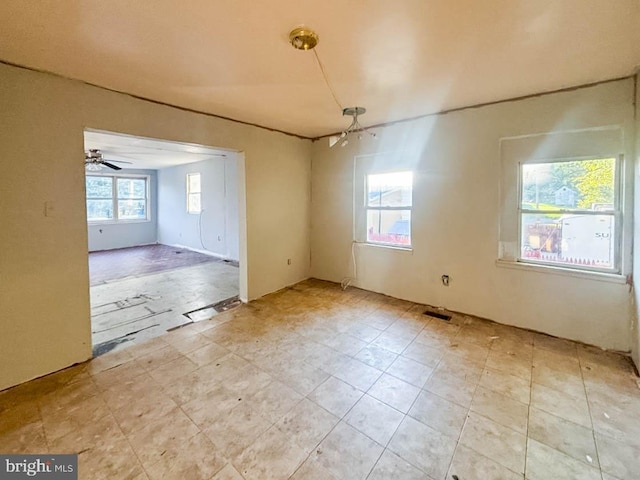 unfurnished room featuring light tile patterned floors