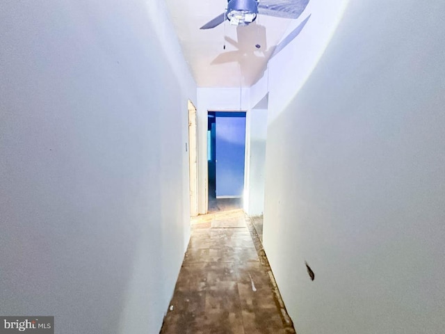 hallway featuring concrete flooring