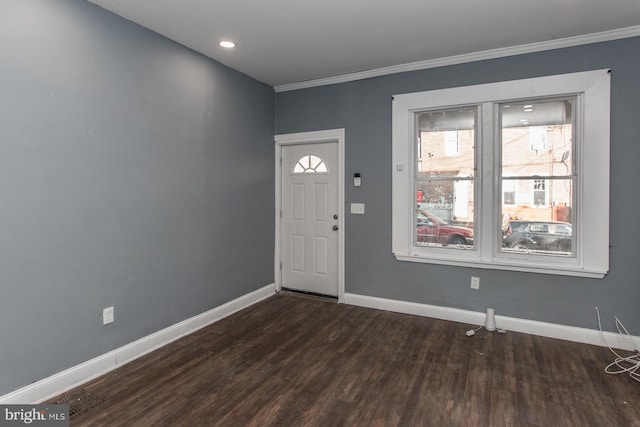 foyer entrance featuring dark hardwood / wood-style flooring and ornamental molding