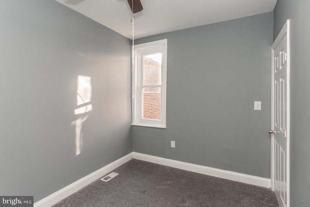 empty room featuring carpet flooring and ceiling fan