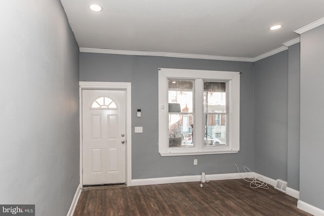 foyer featuring dark hardwood / wood-style flooring and ornamental molding