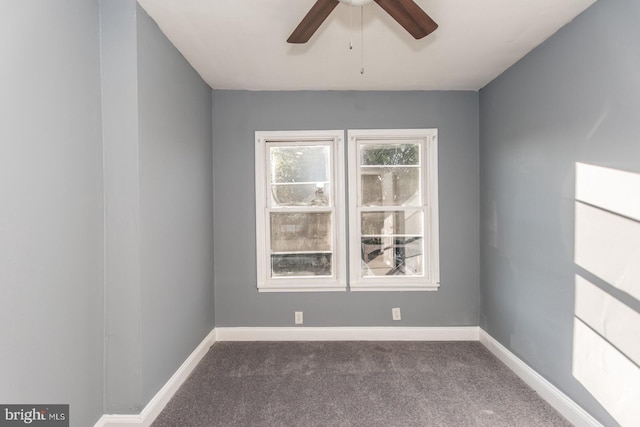 carpeted empty room featuring ceiling fan