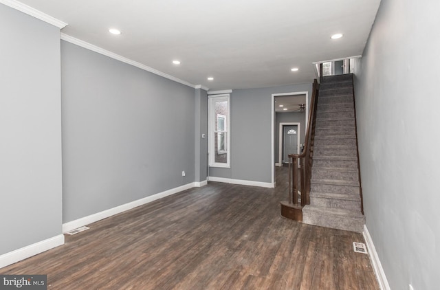 interior space featuring ornamental molding, ceiling fan, and dark hardwood / wood-style floors