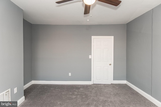 carpeted empty room featuring ceiling fan