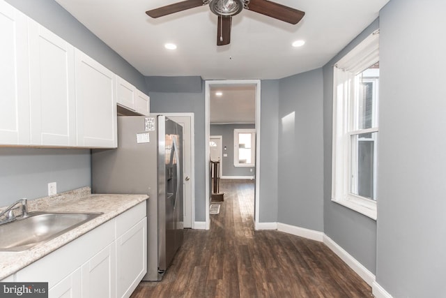 kitchen featuring white cabinetry, sink, ceiling fan, stainless steel fridge with ice dispenser, and dark hardwood / wood-style flooring