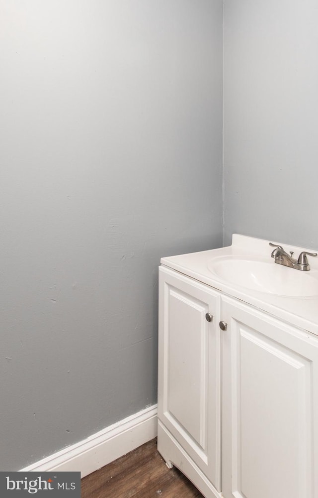 bathroom featuring vanity and hardwood / wood-style flooring