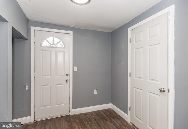 foyer entrance featuring dark hardwood / wood-style floors