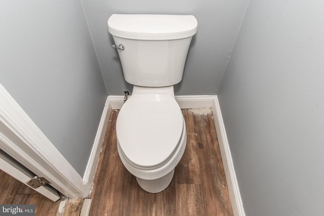 bathroom featuring toilet and hardwood / wood-style flooring