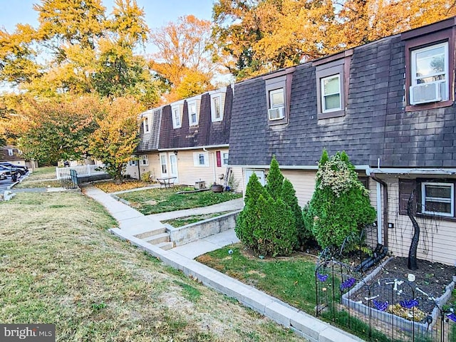 view of front of property with a front lawn