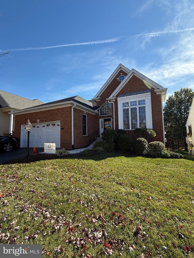 view of front facade with a front lawn and a garage