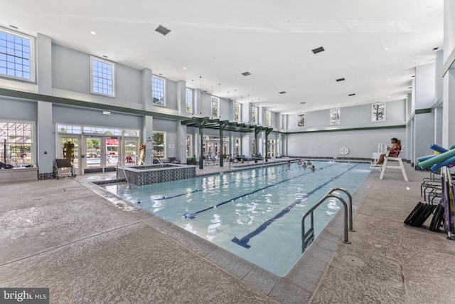 view of pool with french doors