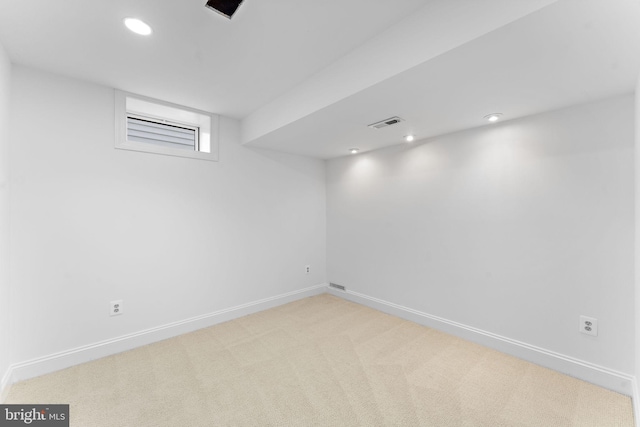 basement with light colored carpet