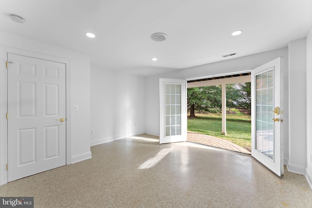 unfurnished room with french doors