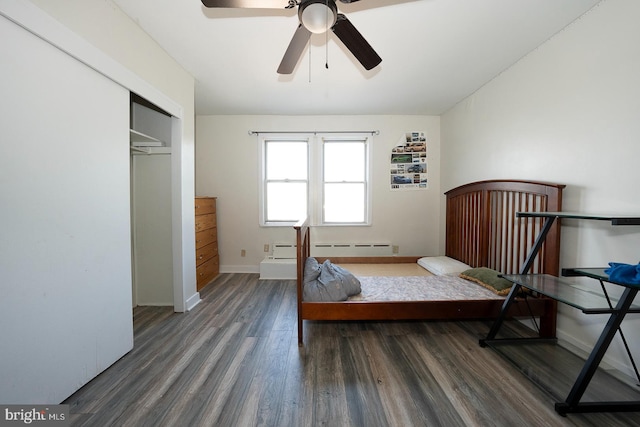 bedroom featuring dark hardwood / wood-style floors, a closet, and ceiling fan