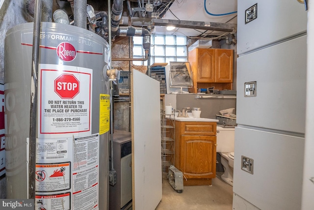 utility room featuring sink and gas water heater