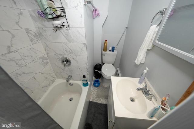 full bathroom with toilet, tiled shower / bath, and vanity