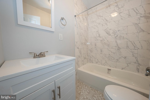 full bathroom featuring vanity, tiled shower / bath combo, and toilet