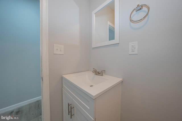 bathroom with vanity and hardwood / wood-style flooring