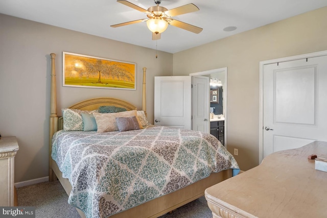 bedroom featuring ensuite bathroom, carpet, and ceiling fan