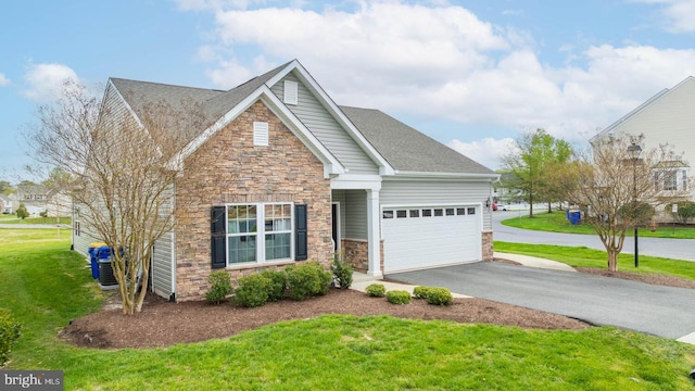 view of front of property featuring a front lawn and a garage