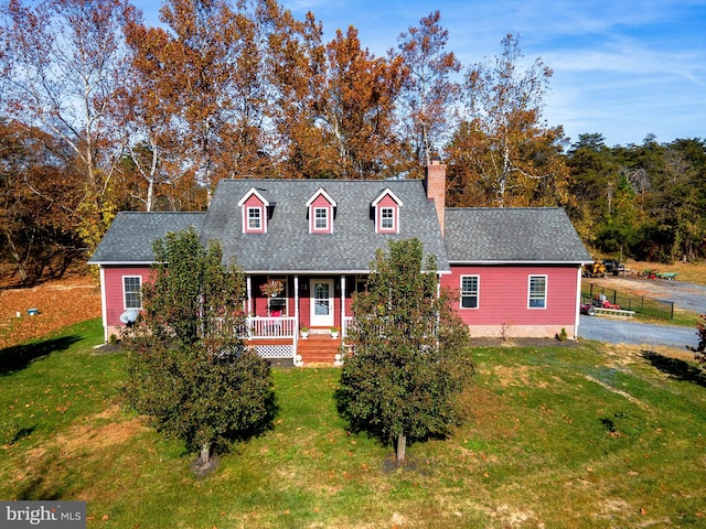 cape cod home featuring a porch and a front yard