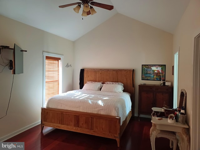 bedroom featuring lofted ceiling, dark hardwood / wood-style floors, and ceiling fan