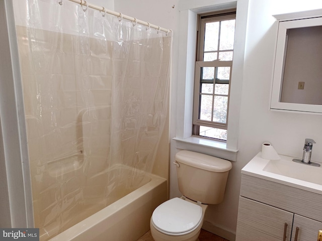 full bathroom featuring vanity, toilet, and shower / tub combo