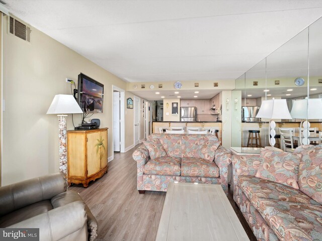 11500 Coastal Hwy Unit 103, Ocean City, MD 21842 - living area with wood finished floors and baseboards