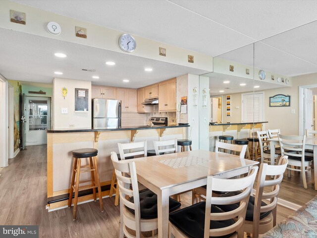 11500 Coastal Hwy Unit 103, Ocean City, MD 21842 - dining area with light wood-type flooring and recessed lighting