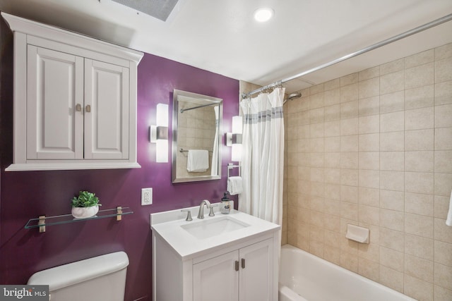 full bathroom with vanity, toilet, and shower / bath combo