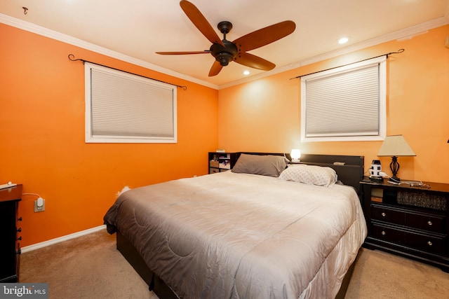 bedroom with ornamental molding, light colored carpet, and ceiling fan